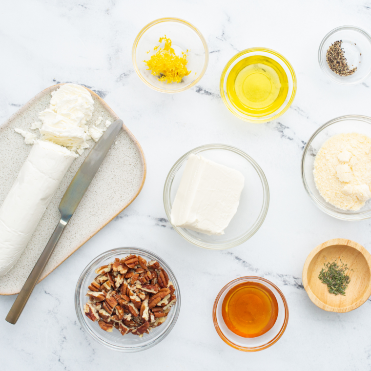 Ingredients for Auntie Anne's cream cheese dip: cream cheese, butter, powdered sugar, vanilla, and salt on a kitchen table