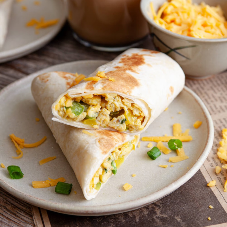 Copycat Buc-ee's breakfast burritos wrapped in foil, ready to serve or freeze