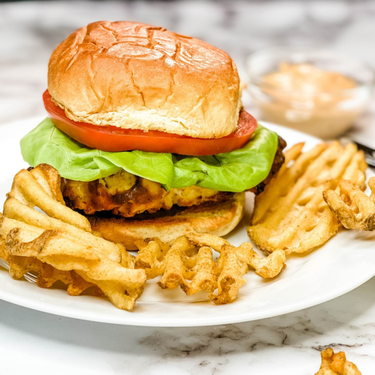 Copycat Buc-ee’s chicken sandwich wrapped in aluminum foil, ready to eat