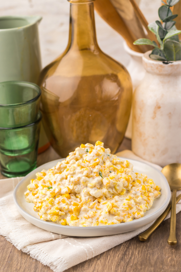 Bowl of copycat Lawry's creamed corn served next to sliced prime rib.