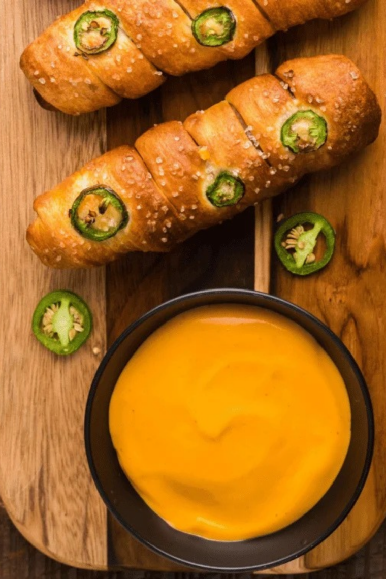 Crispy fry dipped into homemade Wisconsin cheddar cheese sauce