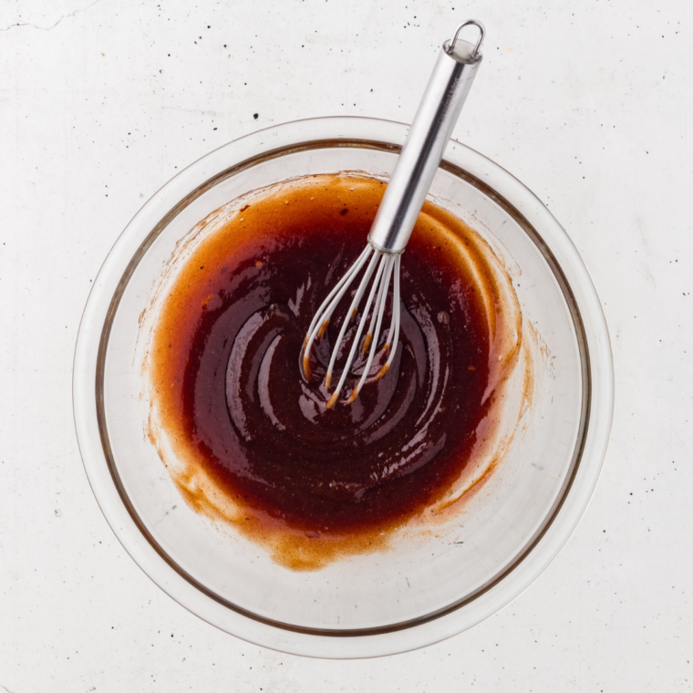 BBQ sauce, chicken broth, apple cider vinegar, and Worcestershire sauce whisked together in a glass bowl