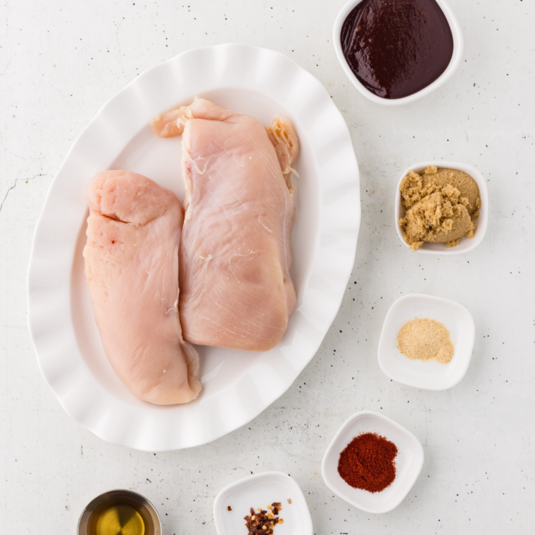 Ingredients for slow cooker barbecue chicken breast: chicken breasts, BBQ sauce, brown sugar, smoked paprika, garlic powder, onion powder, apple cider vinegar, and Worcestershire sauce