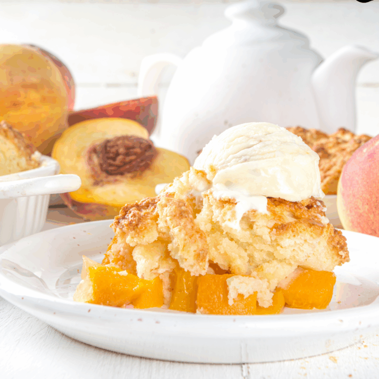 Plate of Longhorn Steakhouse Grilled Peach Cobbler with ice cream on top.