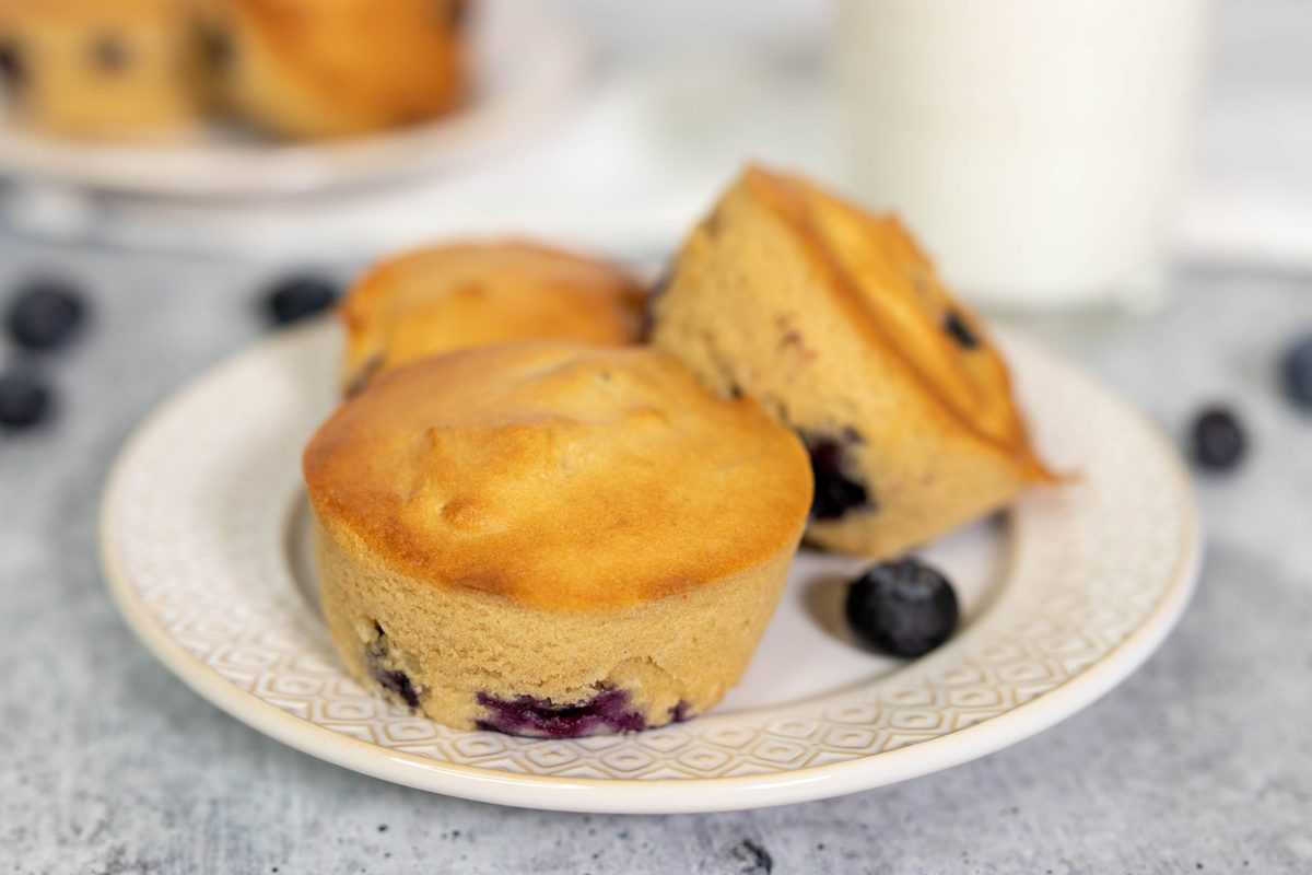 air fryer blueberry muffins on a white plate 