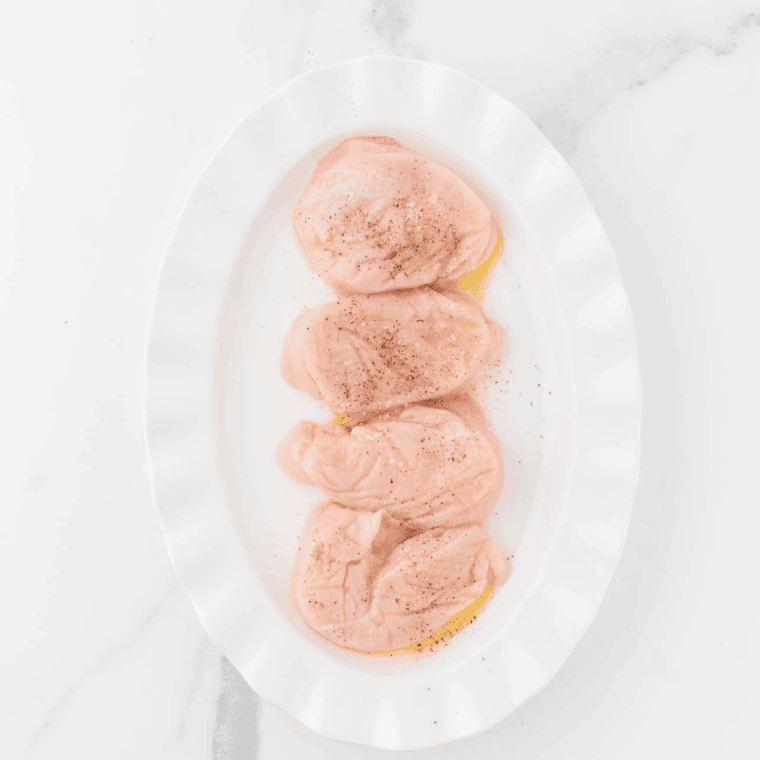 Season the chicken breast.