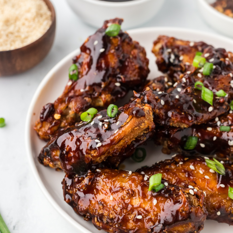 Crispy Chinese chicken wings cooked in the air fryer and garnished with fresh chopped green onions.