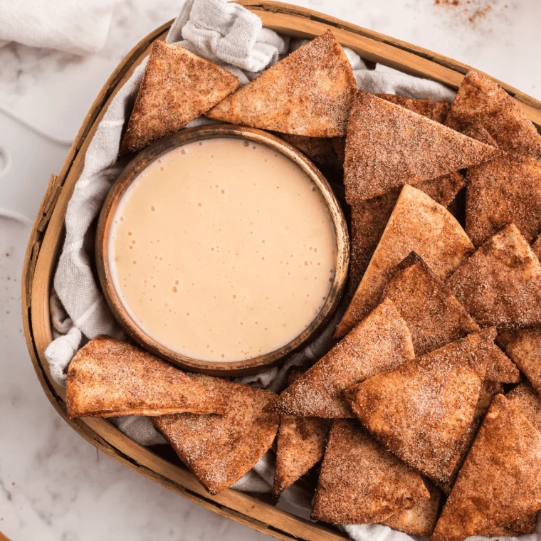 A bowl of crispy air fryer cinnamon sugar tortilla chips, coated with a sweet cinnamon sugar blend.




