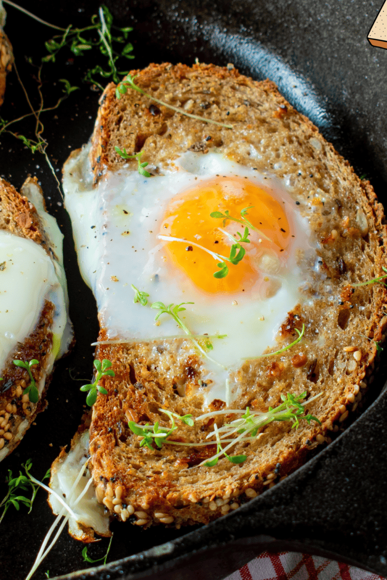 Air Fryer Egg in a Hole with golden toasted bread and a perfectly cooked egg in the center.