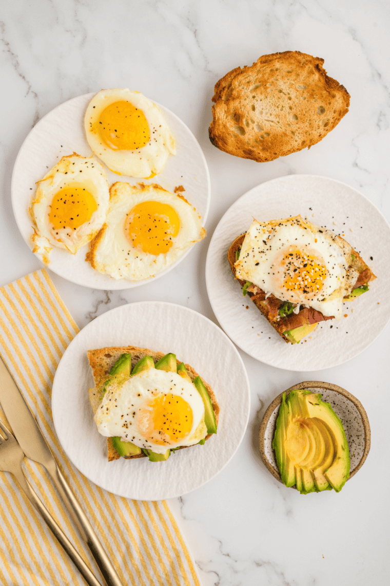 Air fryer fried eggs with crispy edges and a runny yolk.