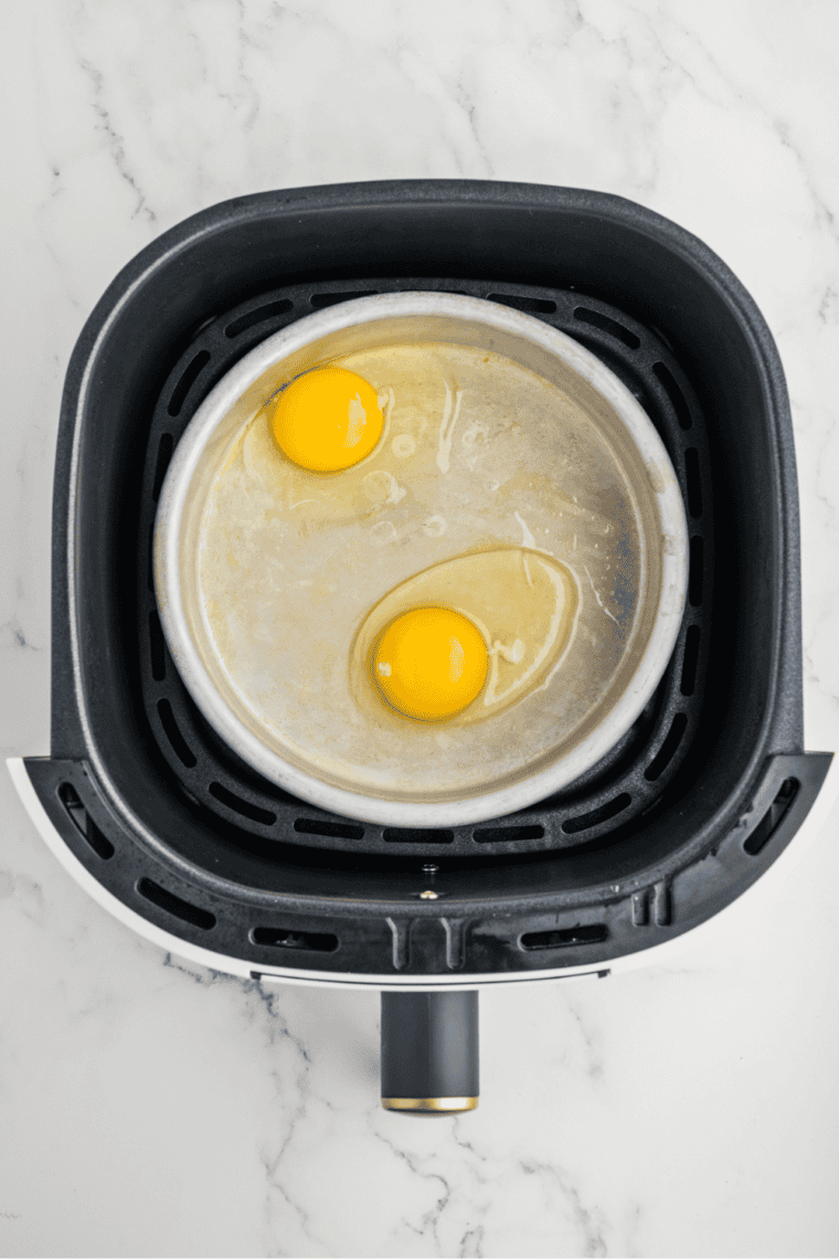 Cracking eggs into the cake pan or baking pan.