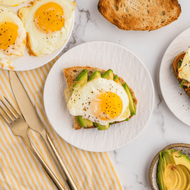 "Delicious air fryer fried eggs with crispy edges and soft yolk.