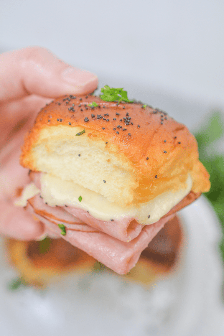Air fryer ham and cheese sliders on King&rsquo;s Hawaiian rolls with melted cheese and buttery toasted tops served warm.