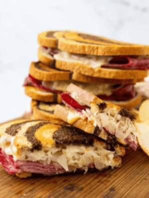 "Delicious Air Fryer Reuben sandwich stacked with corned beef, sauerkraut, Swiss cheese, and Russian dressing."