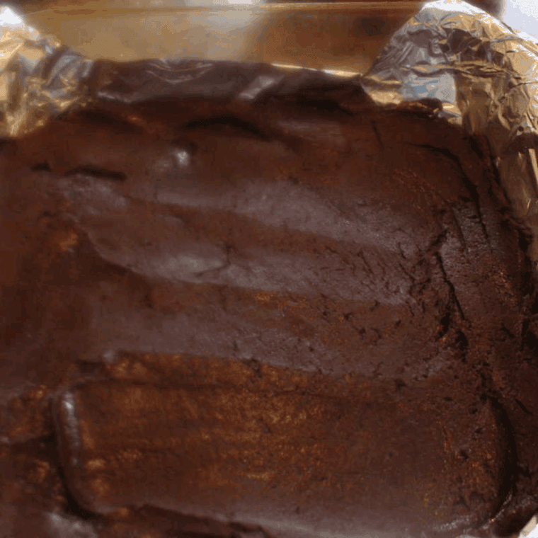 Place Buc-ee’s Fudge in the lined baking pan.