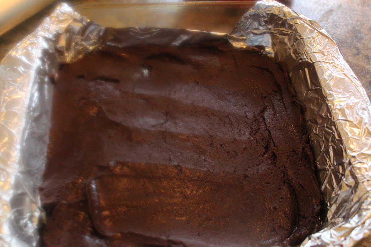 Fudge poured into the foil lined baking sheet. 