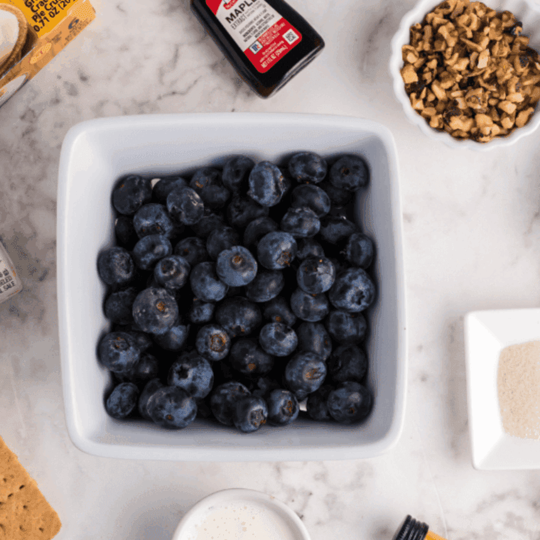 Ingredients needed for Instant Pot Blueberry Pancake Syrup on kitchen table.