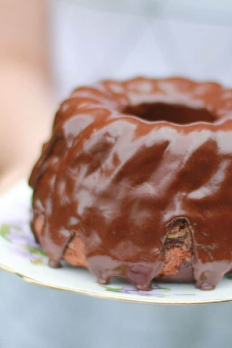 Moist boxed cake cooked in Instant Pot sliced and served with soft texture and frosting on top