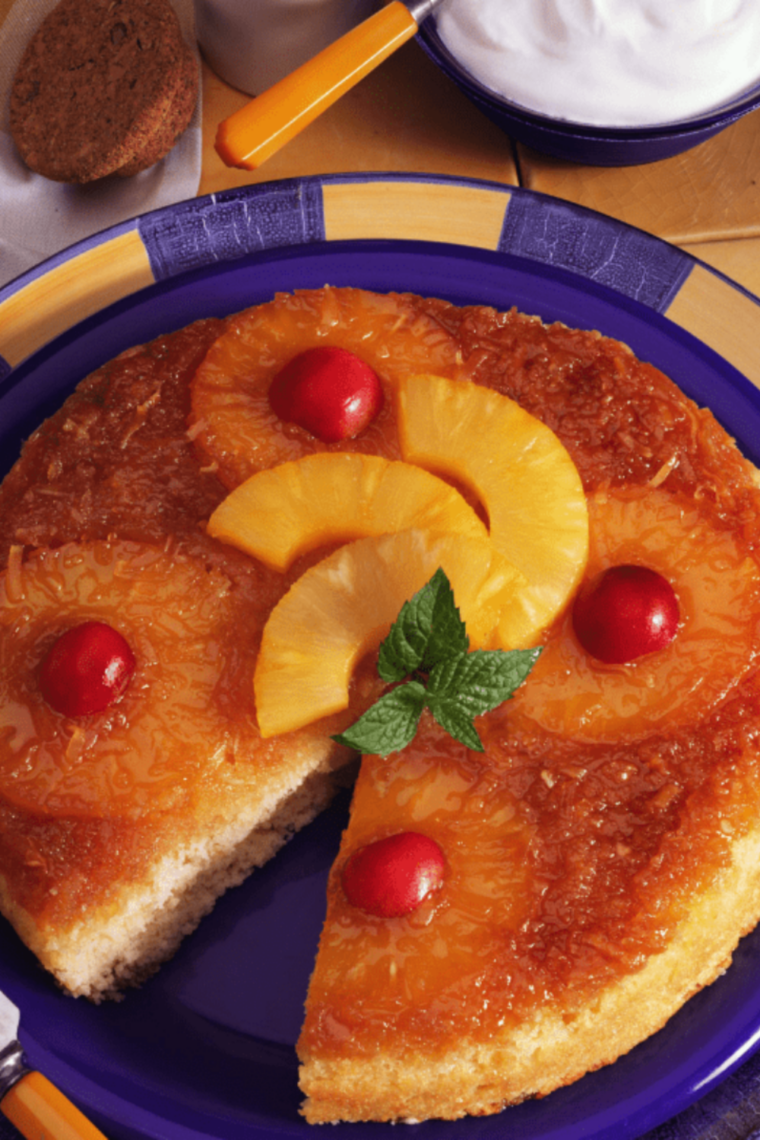 Fluffy Instant Pot box cake made from cake mix sliced on plate with soft moist texture and frosting on top
