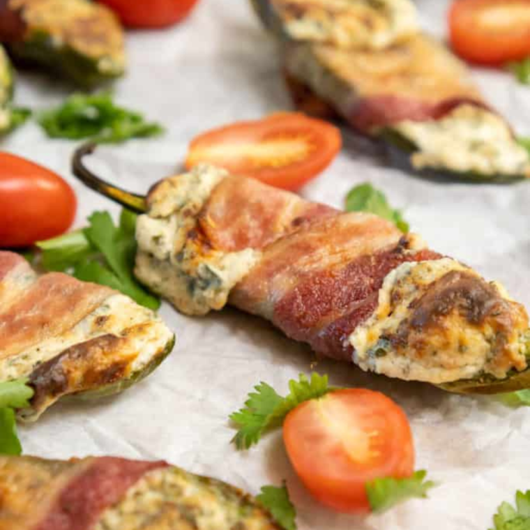 Experimenting with recipe variations for Air Fryer Jalapeño Poppers can add an exciting twist to this classic appetizer. Here are some creative ideas to try:

Air Fryer Bacon-Wrapped Poppers: One of the most popular is bacon jalapeño poppers. For added flavor and texture, wrap each stuffed jalapeño with a strip of thick-cut bacon before air frying. The bacon adds a smoky, savory element.

Buffalo Chicken Poppers: Mix shredded cooked chicken with buffalo sauce into the cream cheese filling for a spicy kick and a nod to buffalo chicken wings.

Vegetarian Poppers: Replace the cheese with a vegan cheese alternative and add finely chopped vegetables like bell peppers or mushrooms to the filling for a vegetarian version.

Crab Stuffed Poppers: Add some cooked, finely shredded crab meat to the cream cheese mixture for a seafood twist on the classic popper.

Tex-Mex Poppers: Mix in taco seasoning, a small amount of salsa, and a blend of cheddar and Monterey Jack cheeses into the cream cheese for a Tex-Mex flair.

Sweet and Spicy Poppers: Add a spoonful of pineapple or mango salsa and 1 tablespoon of jalapeño juice to the cheese filling for a sweet and spicy combination.

Three-Cheese Poppers: Combine cream cheese, shredded cheddar, onion powder, and mozzarella or Parmesan for a more complex cheese flavor.

Greek Style Poppers: Mix feta cheese, spinach, and a bit of dill into the filling for a Mediterranean-inspired variation.

BBQ Poppers: Brush the stuffed poppers with your favorite BBQ sauce before air frying for a tangy and sweet finish.

Italian Poppers: Add chopped sun-dried tomatoes, basil, and mozzarella to the cream cheese filling for an Italian twist.

Each variation has a unique flavor and can be tailored to different tastes and occasions. Feel free to get creative and experiment with different fillings and toppings to discover your favorite version of Air Fryer Jalapeño Poppers!

Pro Tips