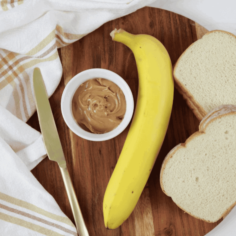 Ingredients needed for Air Fryer Peanut Butter And Banana Sandwich on kitchen table.