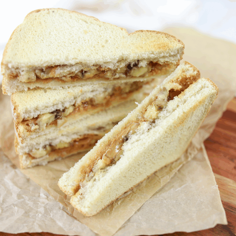 Air Fryer Peanut Butter and Banana Sandwich with golden crispy bread, melted peanut butter, and banana slices inside.