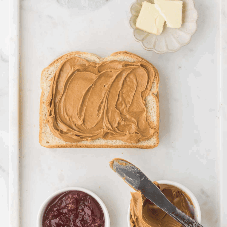 Spread the peanut butter over the top of the bread.