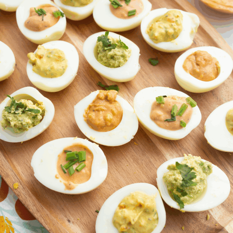 Golden, crispy Southern deviled eggs made in the air fryer, filled with creamy yolk mixture and topped with fresh herbs.
