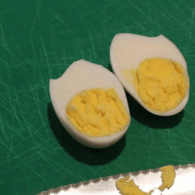 Peel the cooled eggs gently for easy shell removal and smooth results.
