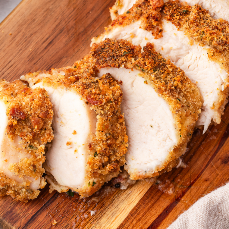 A bowl of homemade KFC seasoning blend with herbs and spices, ready to coat fried chicken for a crispy and flavorful meal.