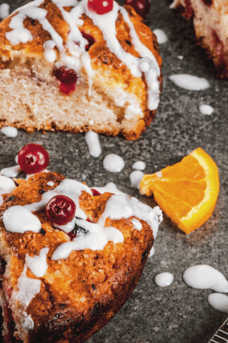 Air fryer cranberry scones baked until golden brown with a flaky texture and cranberry pieces.