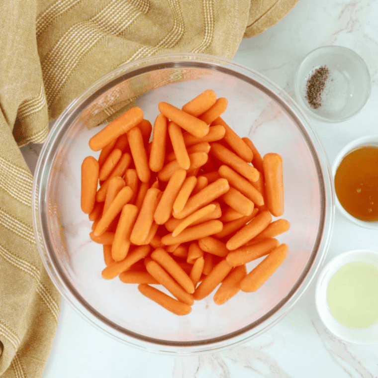 overhead: ingredients needed to make honey roasted carrots in air fryer