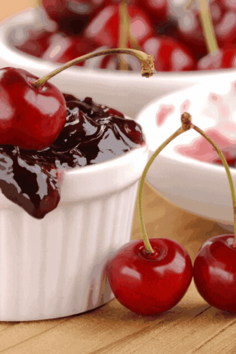 Bowl of homemade Instant Pot cherry jam with a spoon