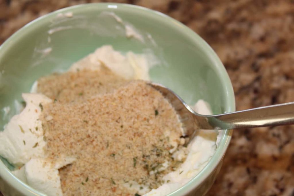 adding bread crumbs to cream cheese