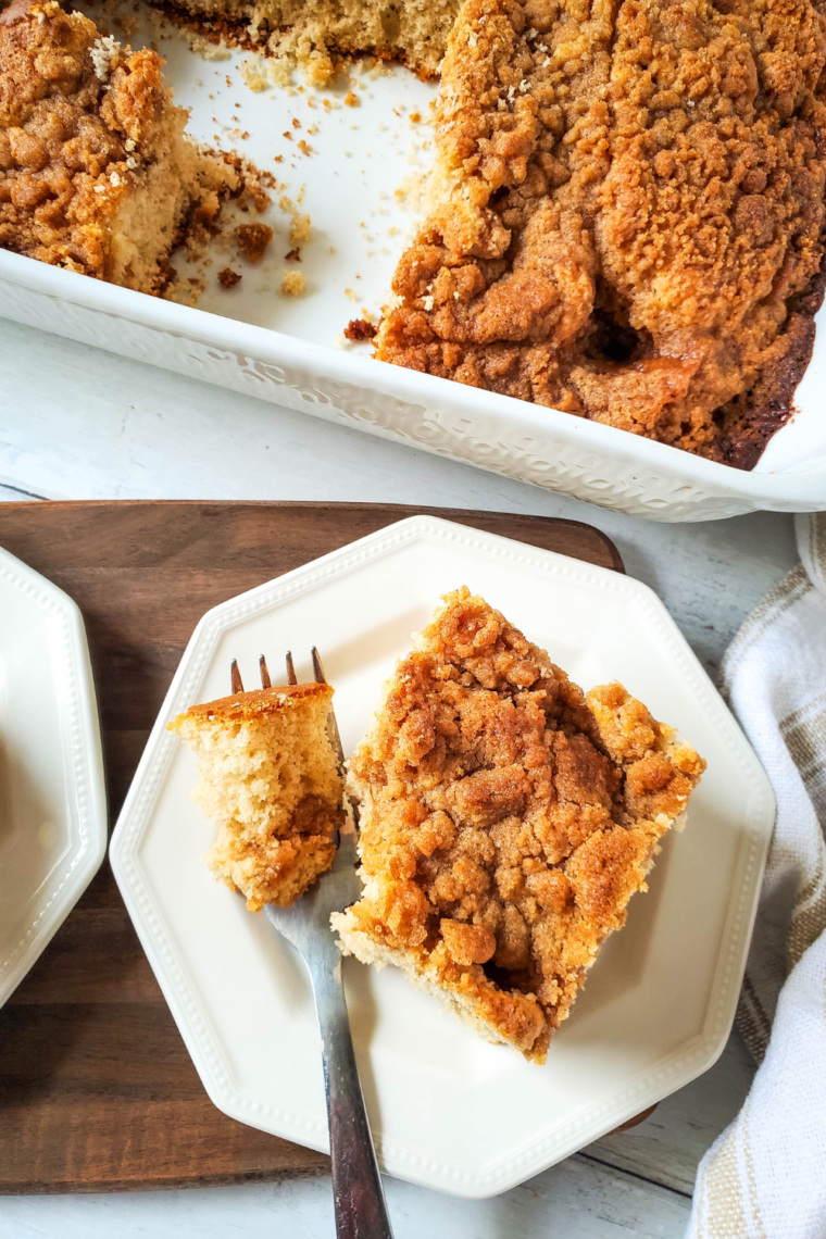 Sliced homemade coffee cake with a crumbly topping from the air fryer.