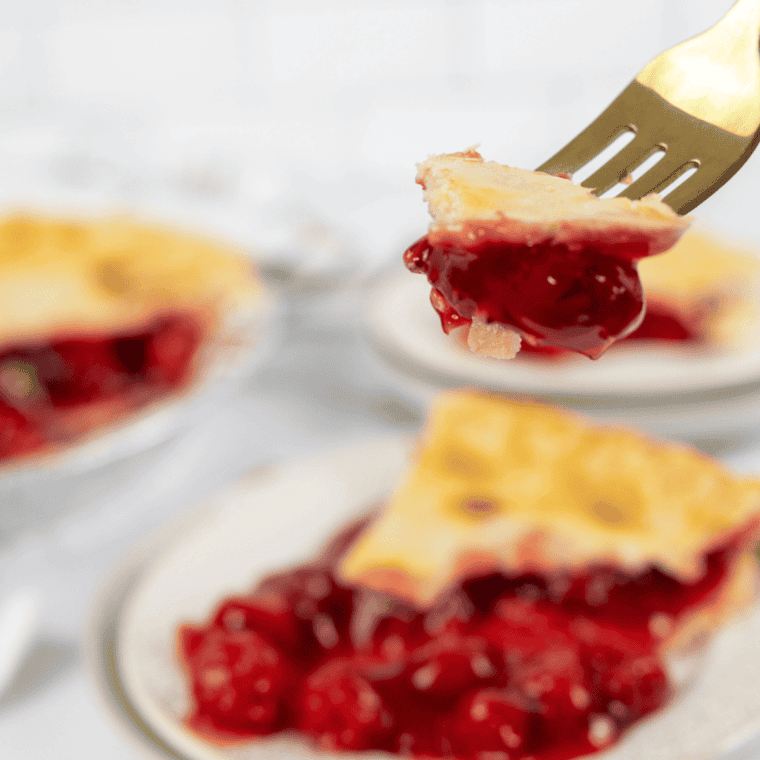 Golden, flaky Air Fryer Easy Cherry Pie with a sweet cherry filling, served warm and topped with a golden crust.