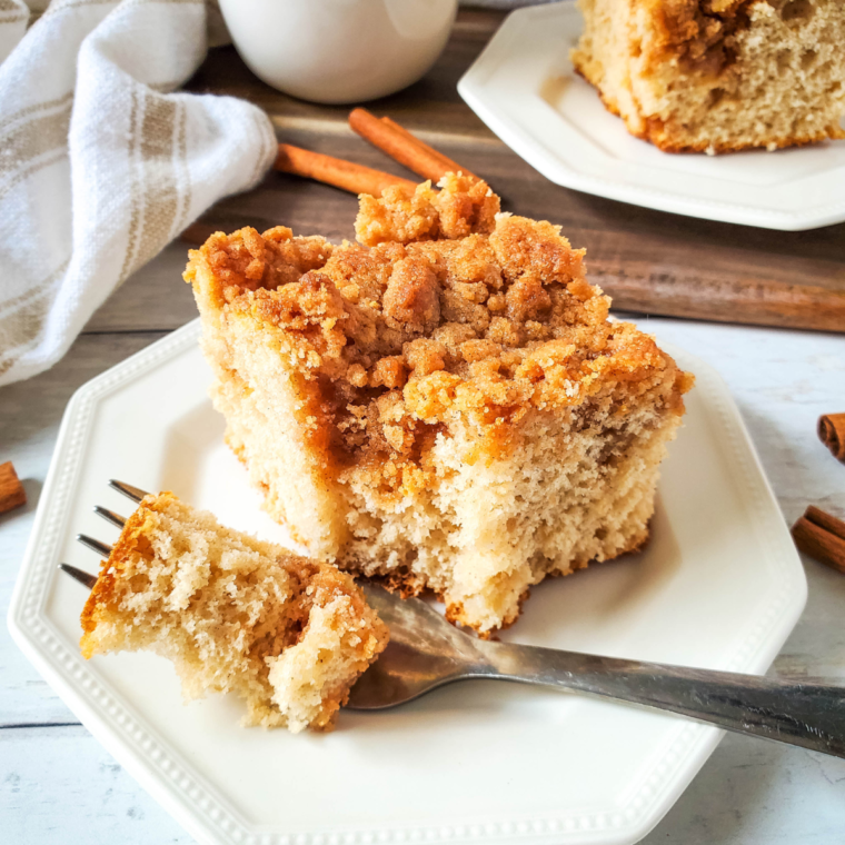 Air fryer homemade coffee cake with cinnamon topping served on a plate.