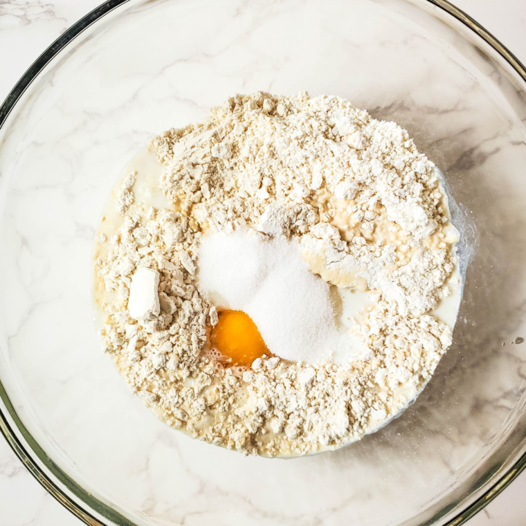 Mixing Bisquick, milk, egg, sugar, and cinnamon for coffee cake batter in a large bowl.