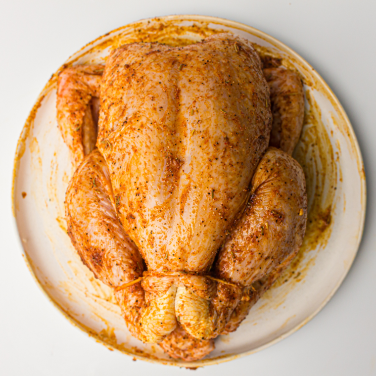 Rub the seasoning mixture over the top of the chicken.