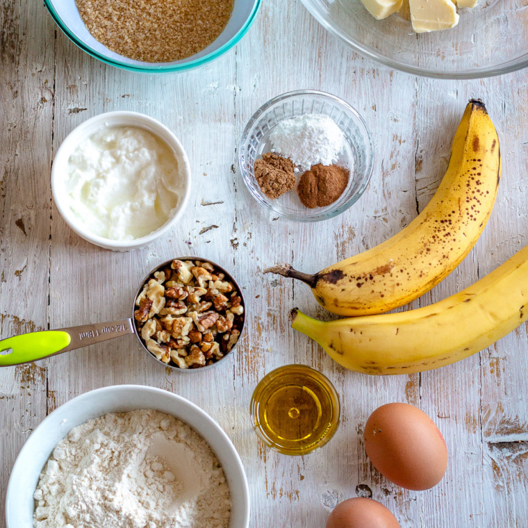 Ingredients needed for Easy Kona Inn Banana Bread Recipe on kitchen table.