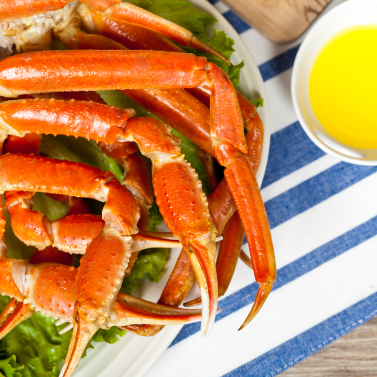 Close-up of perfectly cooked Instant Pot crab legs served with lemon and butter.