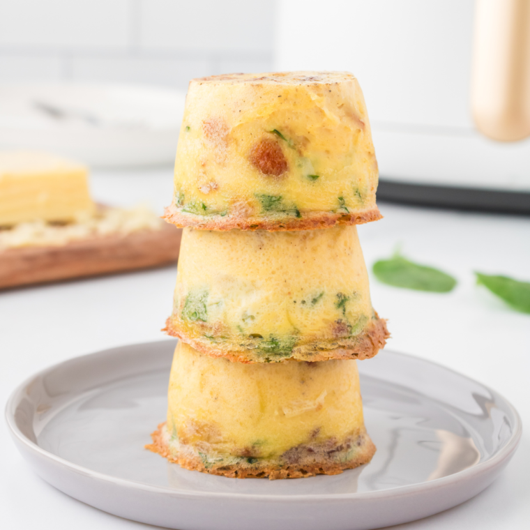 "Close-up of Instant Pot Keto Egg Bites, showcasing their perfect texture and garnished with herbs."