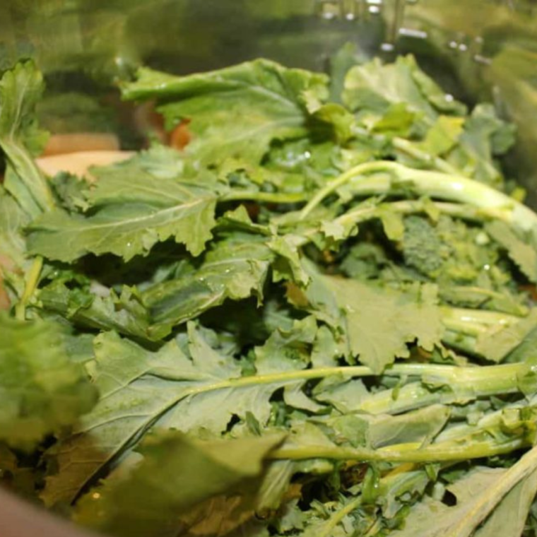 A vibrant image of the completed Instant Pot Penne with Sausage and Broccoli Rabe, served in a bowl and garnished.