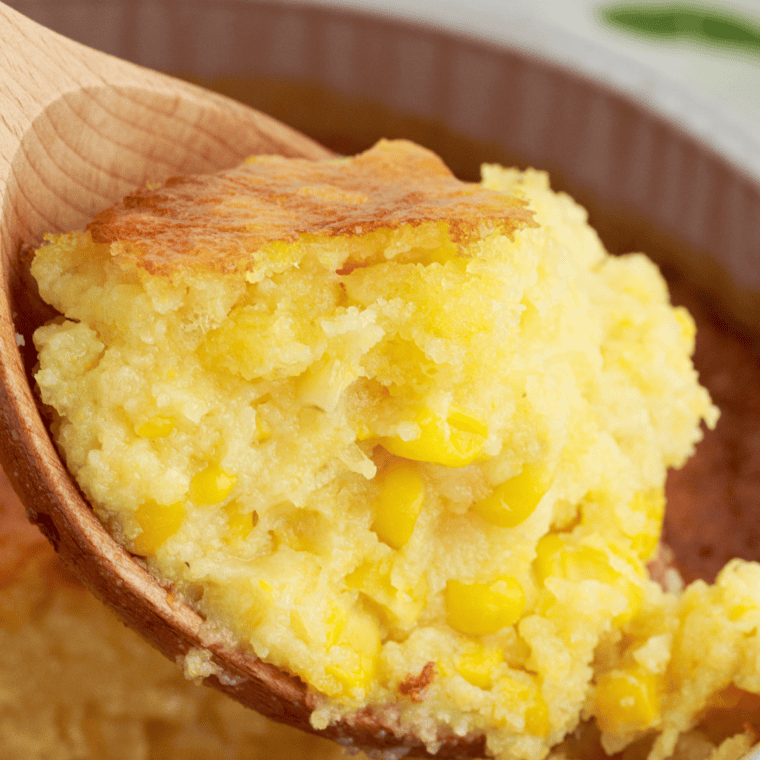 A serving of golden and fluffy Air Fryer Corn Casserole with a slightly crispy top, ready to be enjoyed.