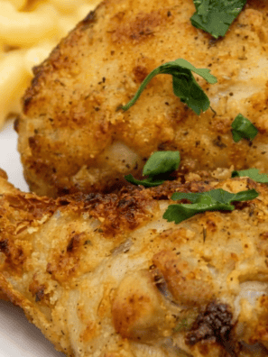 Air fryer Kentucky Kernel fried chicken drumsticks with a crispy golden coating on a white plate