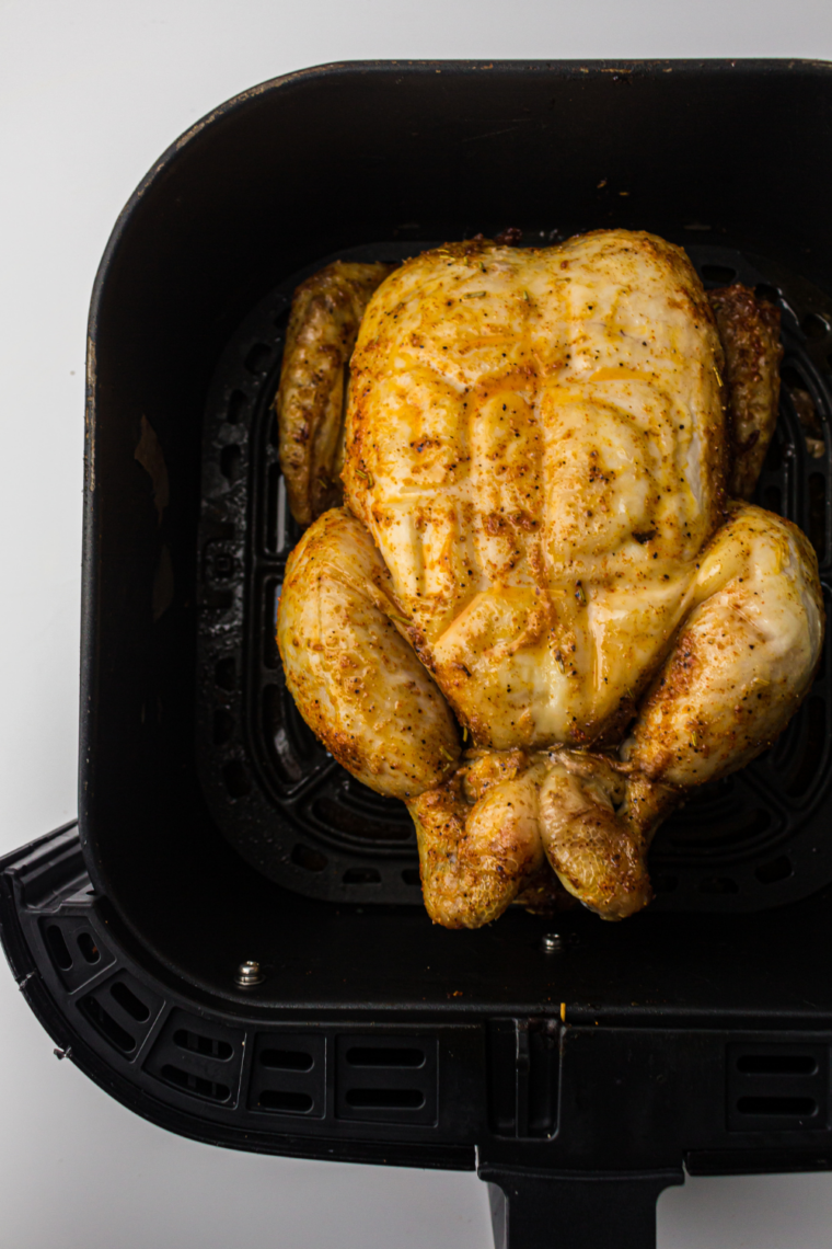 Crispy whole chicken in air fryer with golden brown skin