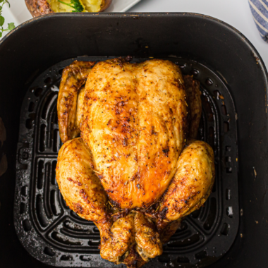 Whole chicken in air fryer with crispy golden skin