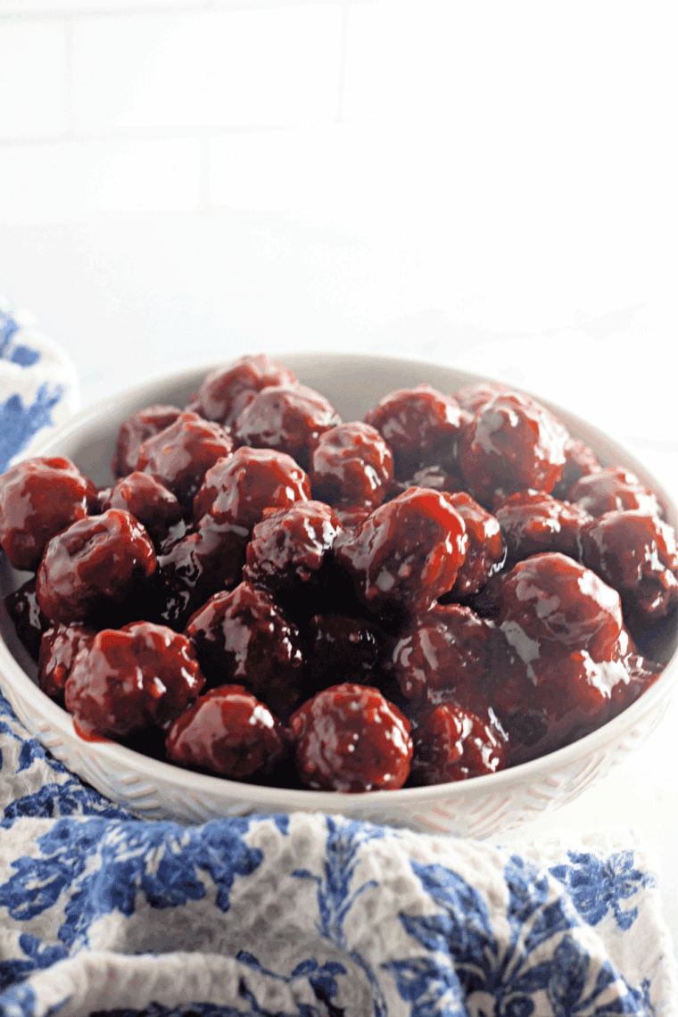 Delicious Instant Pot Honey Garlic BBQ Meatballs served on a platter or in a bowl, garnished with sesame seeds and fresh green onions.
