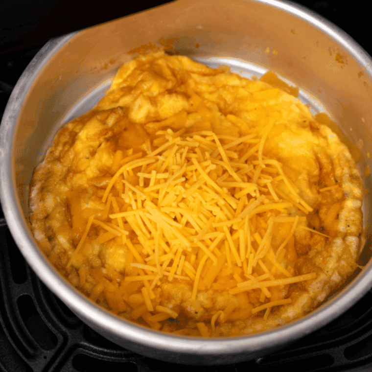 Place omelet in the baking pan and place into the air fryer basket.