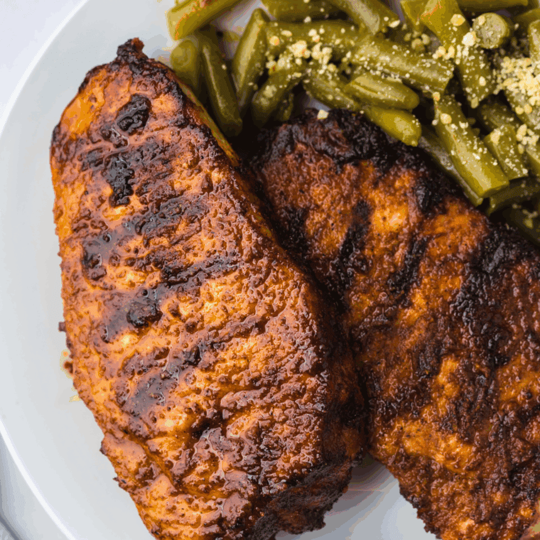 Serving the perfectly cooked BBQ pork chops with your favorite sides.